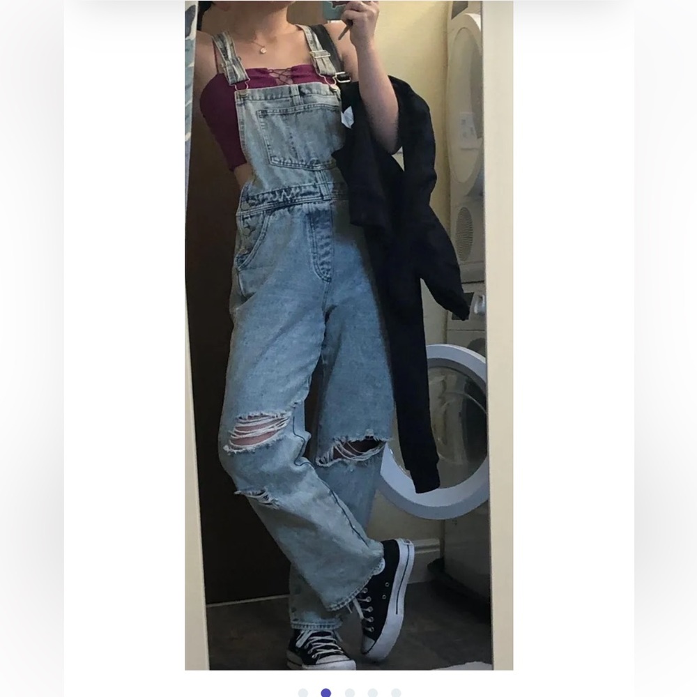 Distressed denim overalls